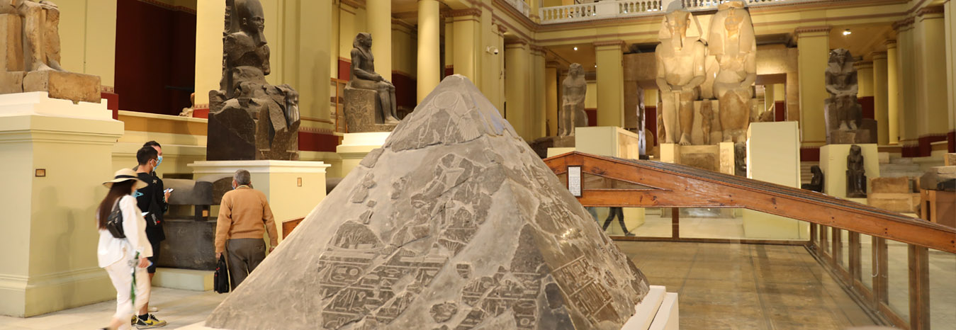 Historic facade of the Egyptian Museum in Cairo, home to King Tutankhamun's gold treasures.
