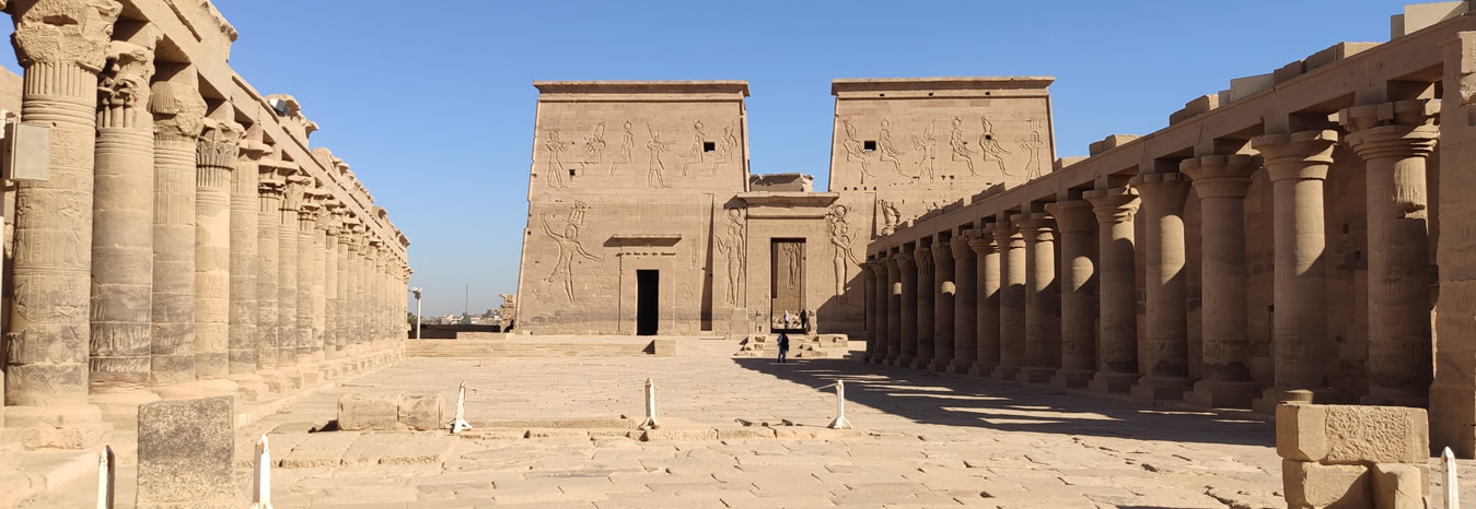 The Temple of Isis on Philae Island, Aswan, reflected in the waters of the Nile.