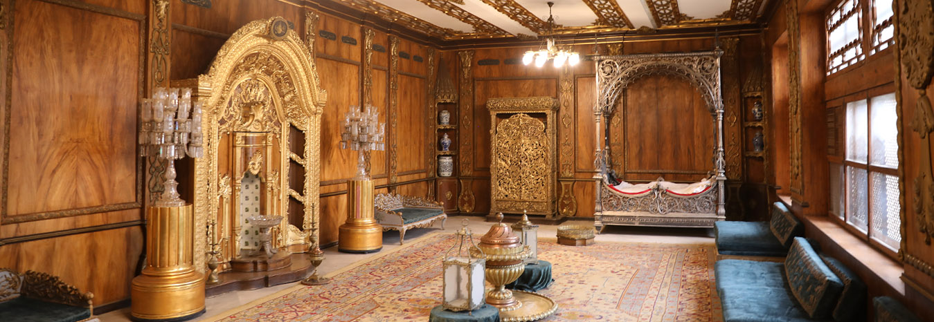 Detailed Islamic architecture and lush gardens of the Manial Palace in Cairo.