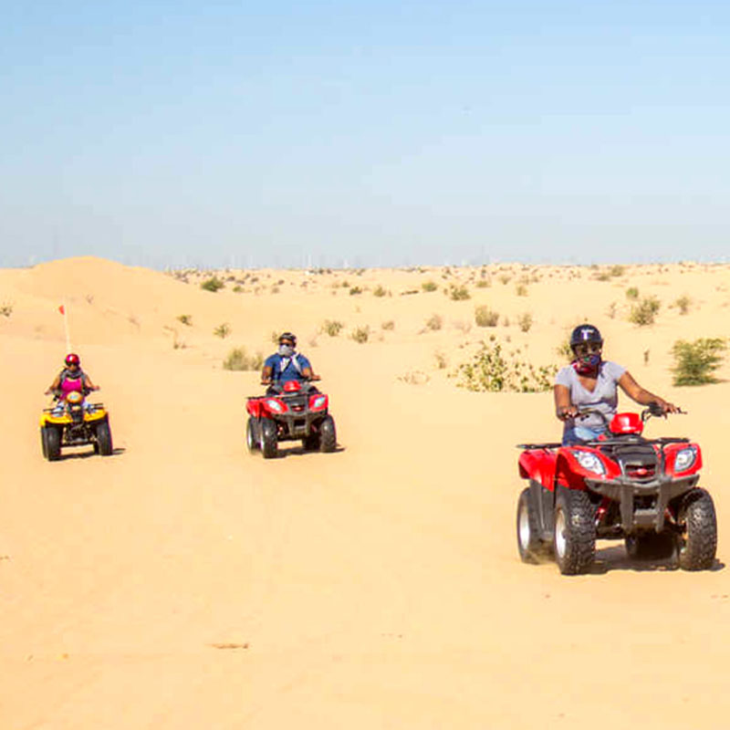 Travelers enjoying a desert quad bike safari adventure during the 13 Days Egypt Tour & Red Sea Holiday by Avatar Travel.