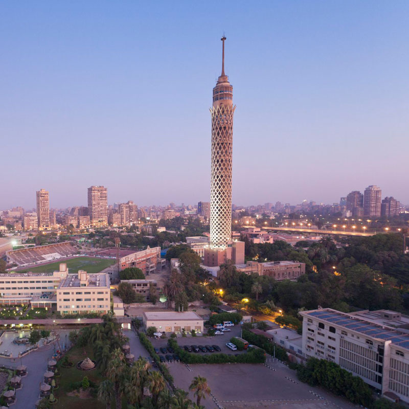Panoramic city view of the Cairo Tower at sunset, part of the 9 Days Egypt Heaven Tour by Avatar Travel.