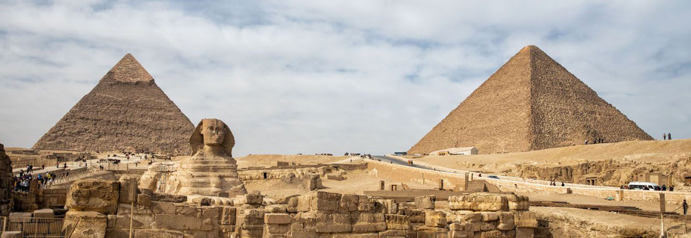 The Great Pyramid of Khufu and the Sphinx at the Giza Plateau during a private guided tour.
