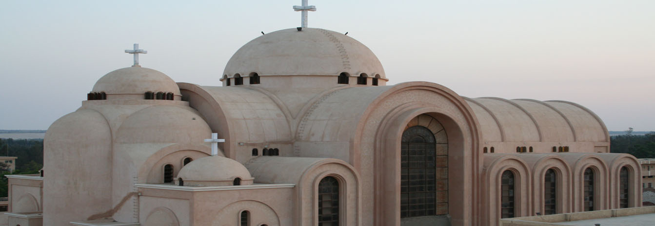 Arched entrance and traditional Coptic architecture of the Monastery of Anba Bishoy in Wadi Natrun.