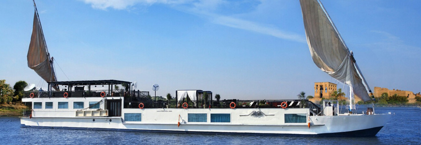 The elegant Dahbya Merit traditional sailing boat with twin masts on the Nile River.