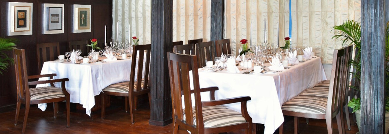 A beautifully set dining table on the Dahbya Merit deck prepared for a traditional Egyptian dinner.