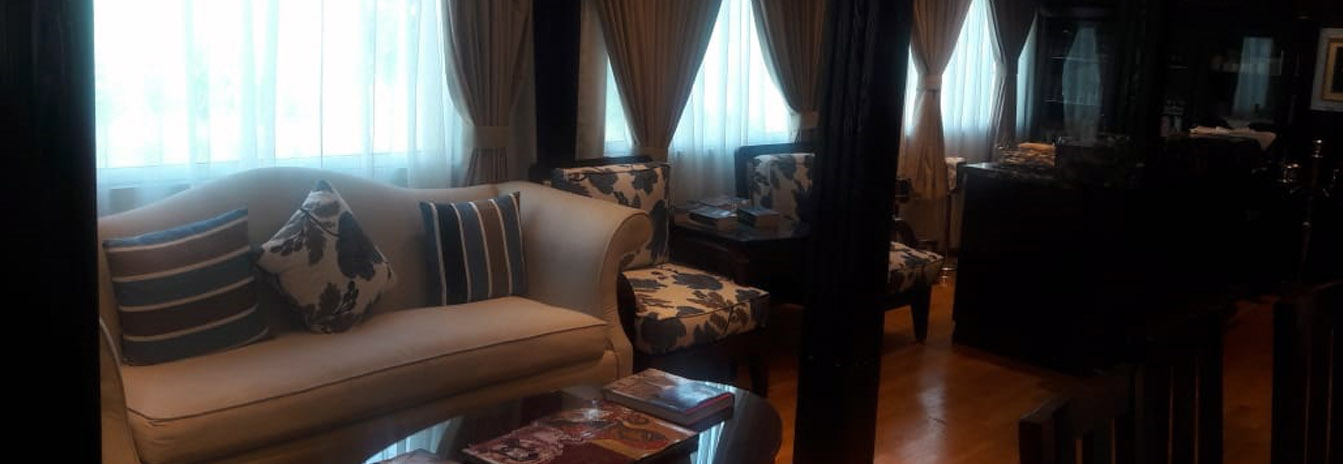 Luxury interior lounge of the Dahbya Merit Nile Cruise with elegant sofas and large windows.