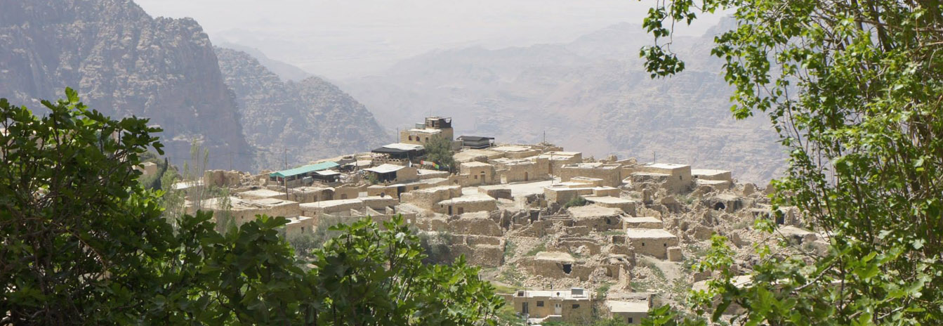 Historic Dana Village stone houses overlooking the Dana Biosphere Reserve canyon in Jordan.
