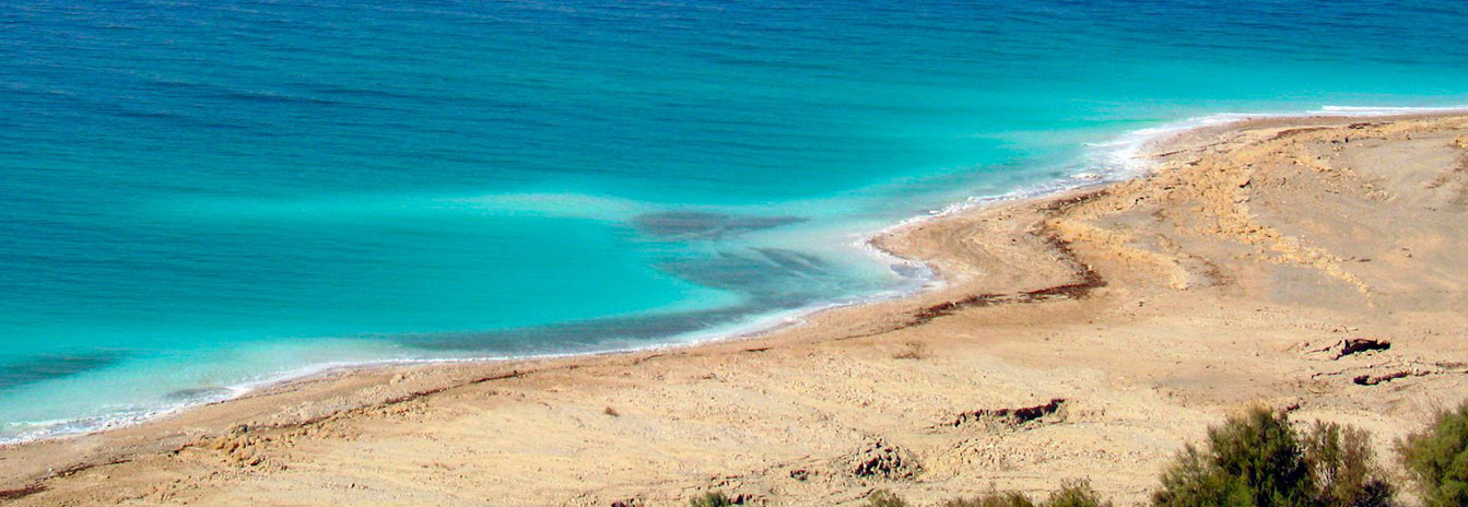 Travelers floating effortlessly in the mineral-rich waters of the Dead Sea in Jordan