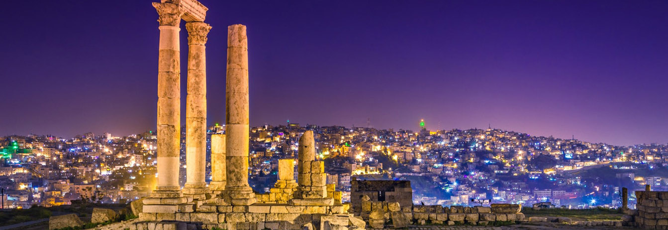 Panoramic view of the Amman Citadel ruins overlooking the modern skyline of Jordan's capital