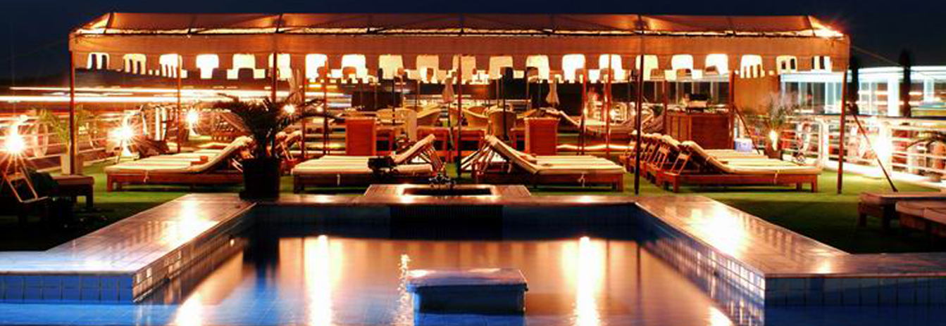 The stylish sun deck bar on the MS Sunray with comfortable seating and river views.