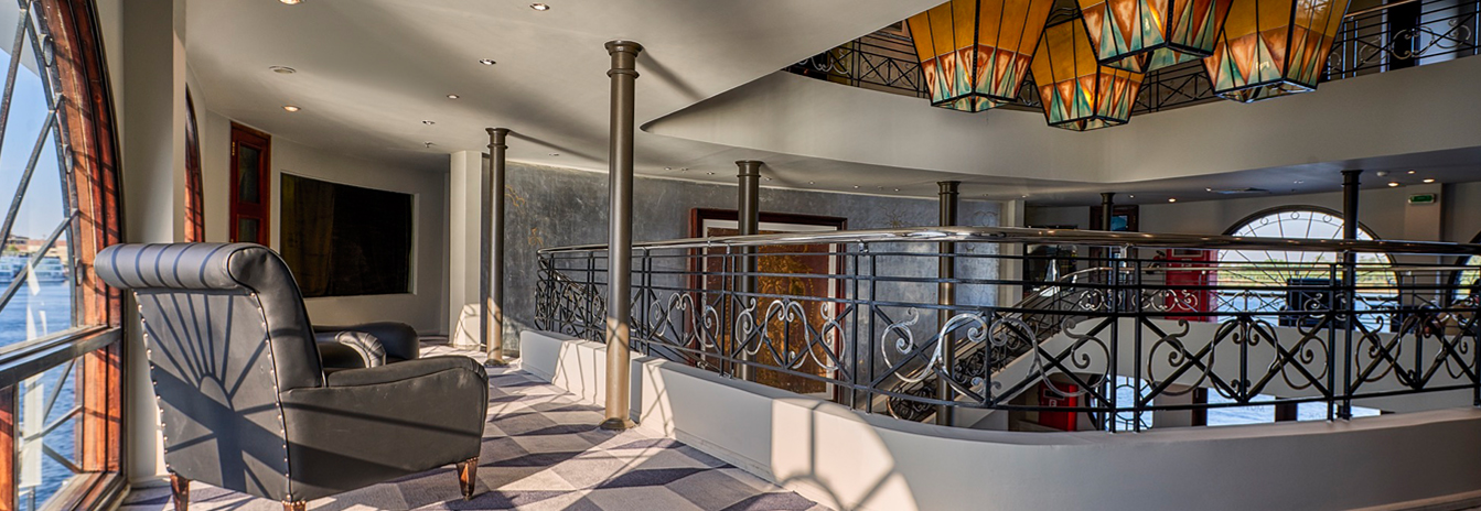 The modern 5-star Mövenpick MS Sunray cruise ship sailing the Nile River near Luxor.