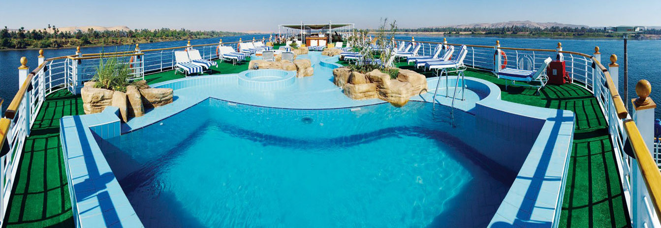 The expansive sun deck of a Mövenpick cruise ship featuring a swimming pool and shaded lounge area.