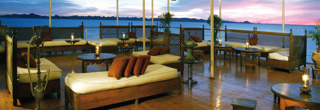 The classic wood-paneled dining room of the Mövenpick Prince Abbas cruise ship.