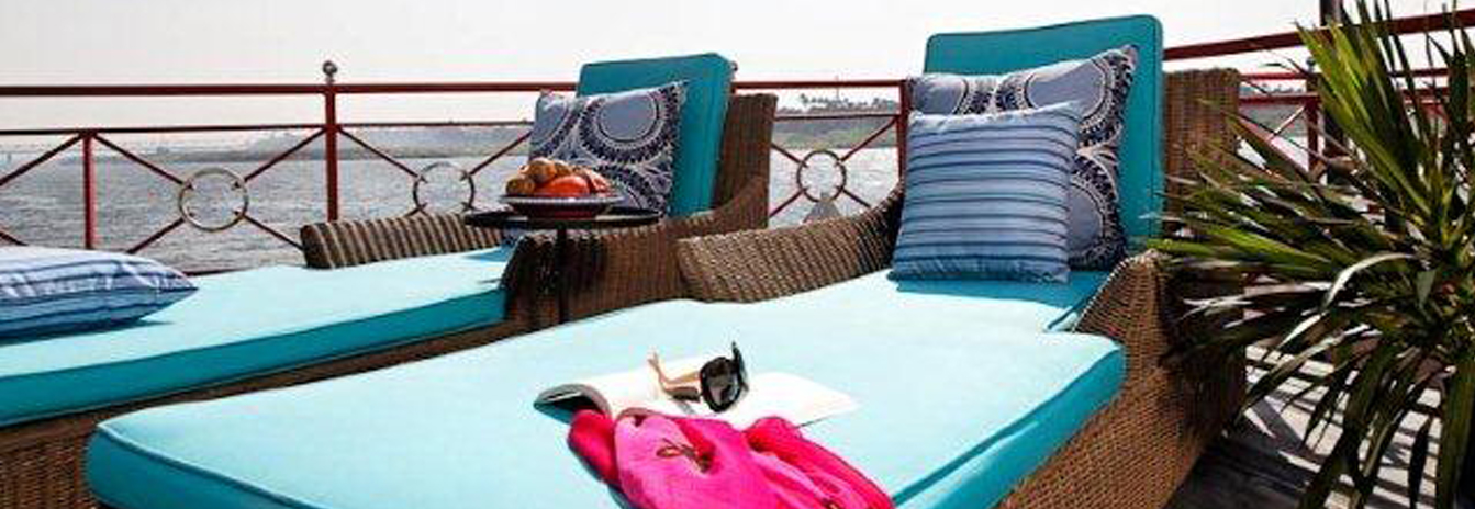The upper sun deck of the Mövenpick SB Feddya with comfortable lounge seating and an outdoor Jacuzzi.