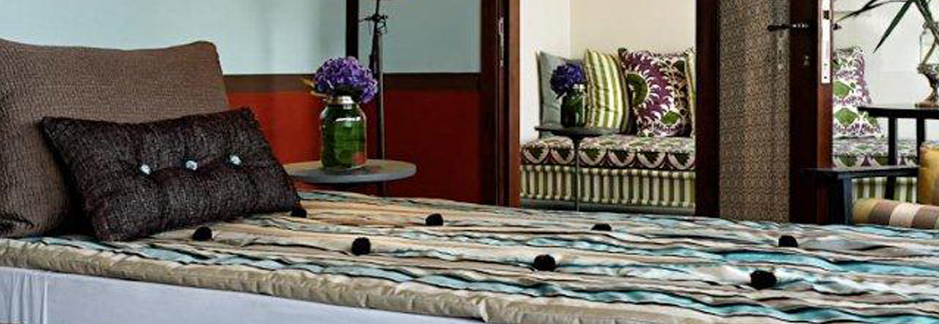 One of the four contemporarily designed suites on the Mövenpick SB Feddya featuring a private balcony.