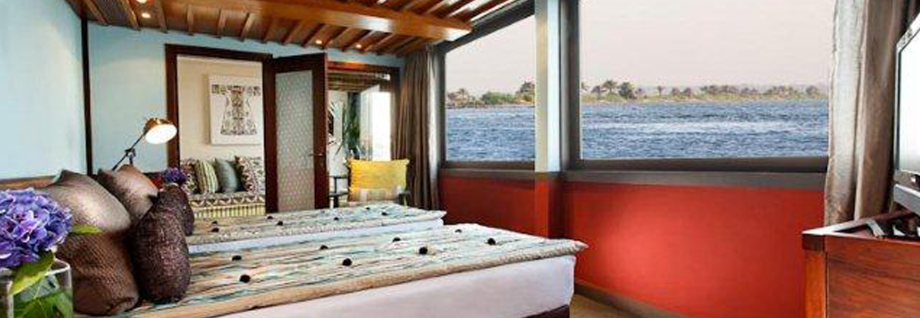 The luxury Mövenpick SB Feddya boutique sailing vessel with traditional twin sails on the Nile.