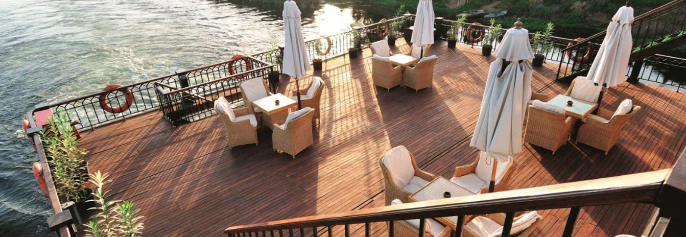 Upper sun deck of the Mövenpick SS Misr with classic lounge chairs.