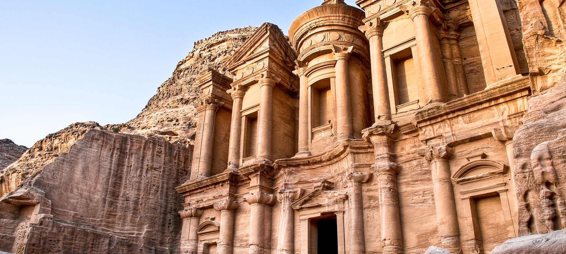 The Treasury (Al-Khazneh) at Petra carved into red sandstone, representing Jordan highlights and adventure excursions.