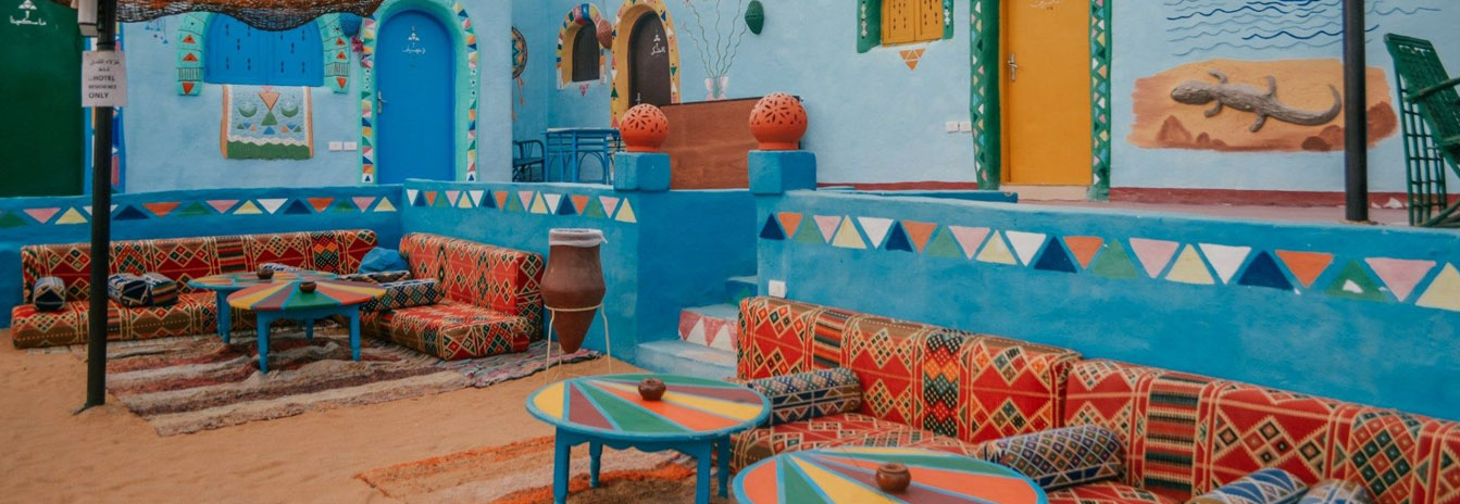 Brightly painted traditional Nubian houses with geometric patterns in a village near Aswan