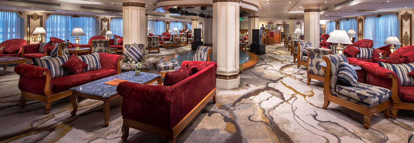 The grand French-style lobby and gold-leaf staircase of the Sonesta St. George Nile Cruise ship.