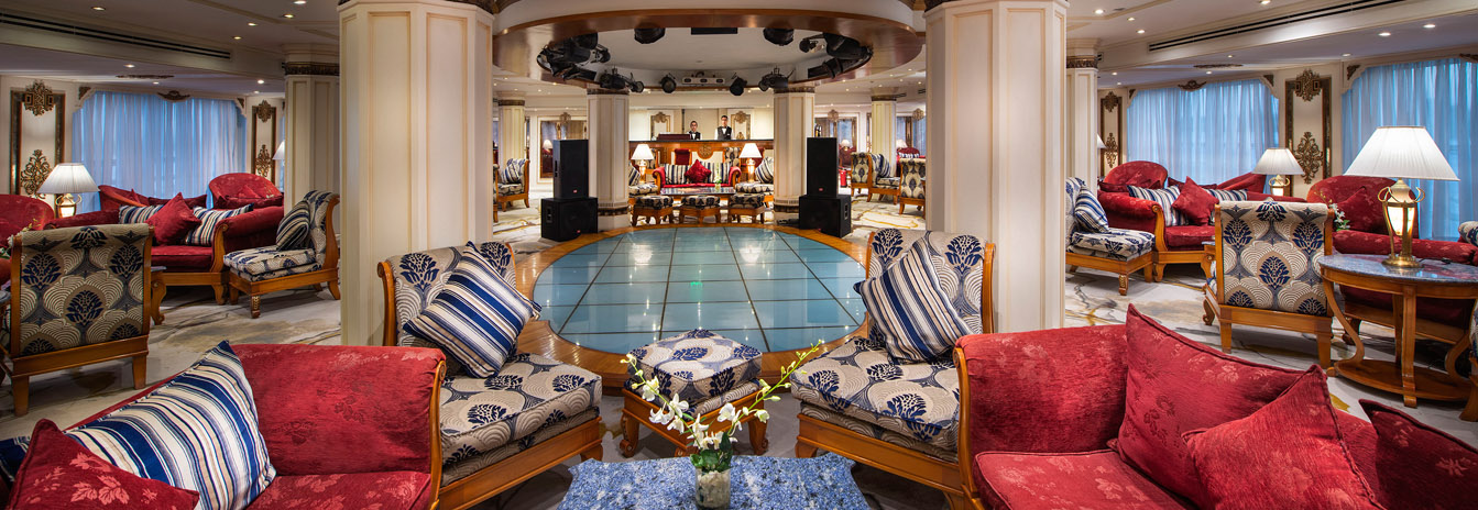The grand French-style lobby and gold-leaf staircase of the Sonesta St. George Nile Cruise ship.