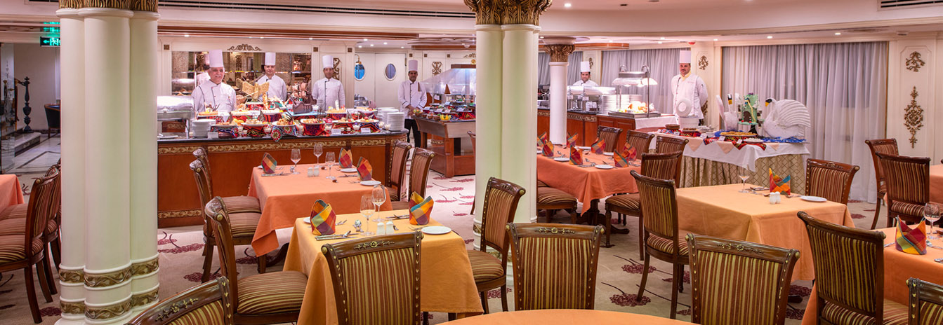 The 5-star Sonesta St. George I Nile Cruise ship docked in Aswan, featuring its signature French-style architecture.