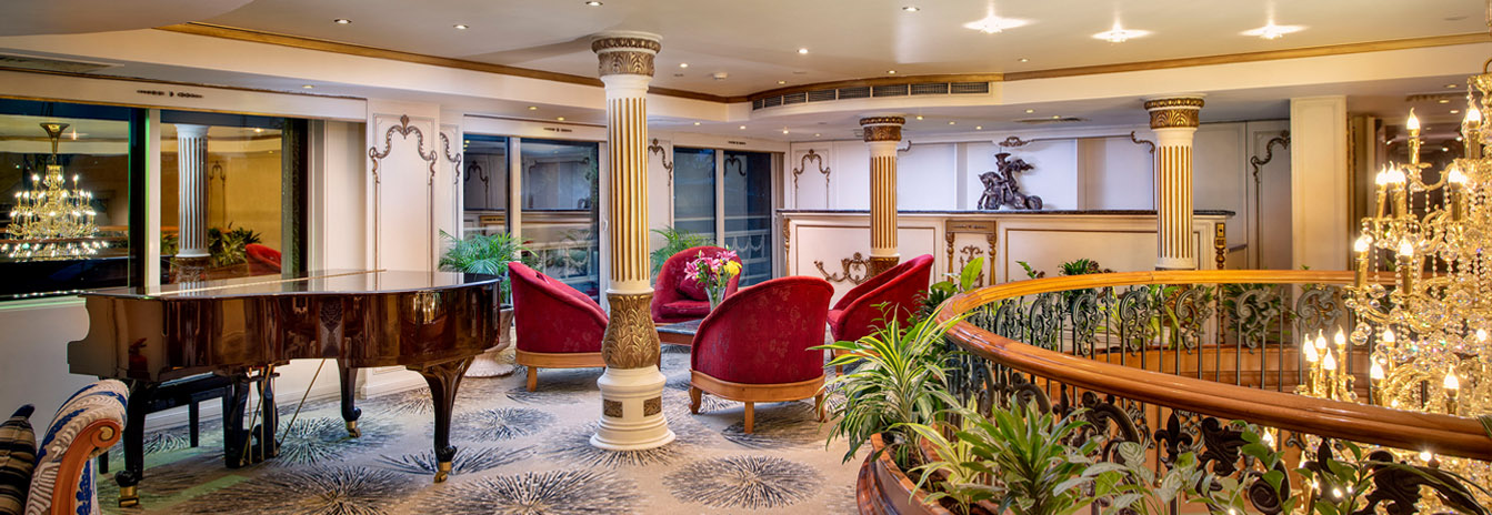 The elegant Piano Bar on the Sonesta St. George Nile Cruise featuring classical décor and a sophisticated atmosphere.