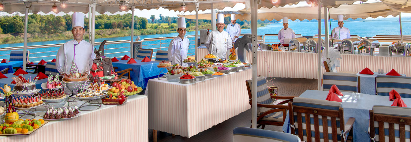 The spacious sun deck of the Sonesta St. George cruise ship featuring an oversized pool and cushioned lounge chairs.
